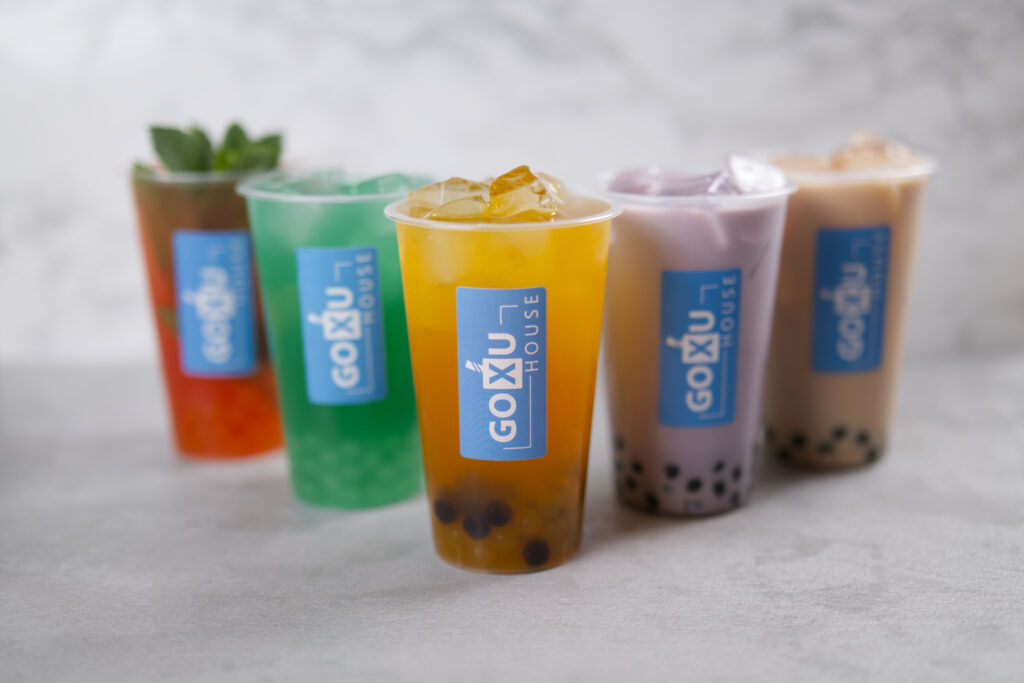 Selection of bubble teas lined up – colorful and refreshing drinks with tapioca pearls.